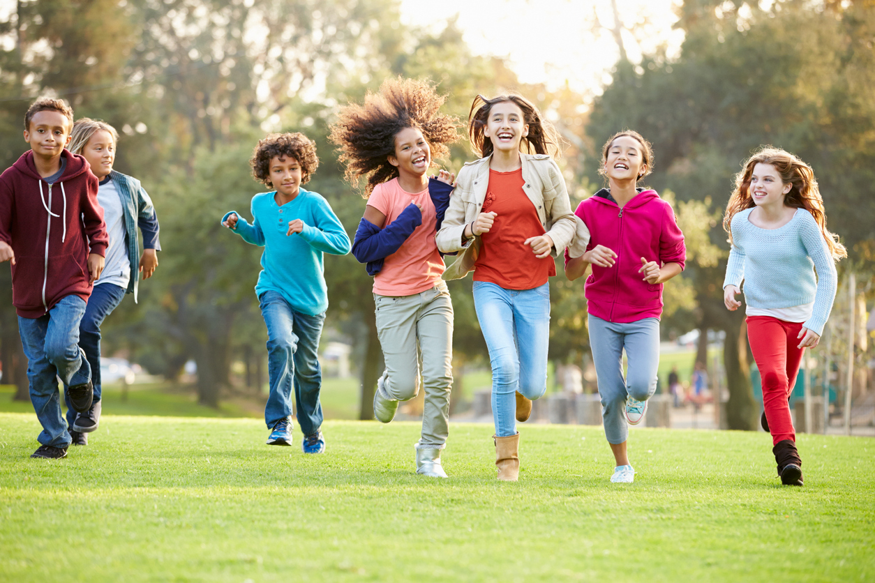 Group of children running outside