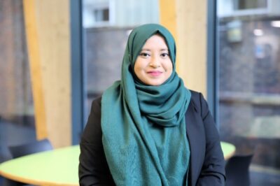 A woman smiling at the camera