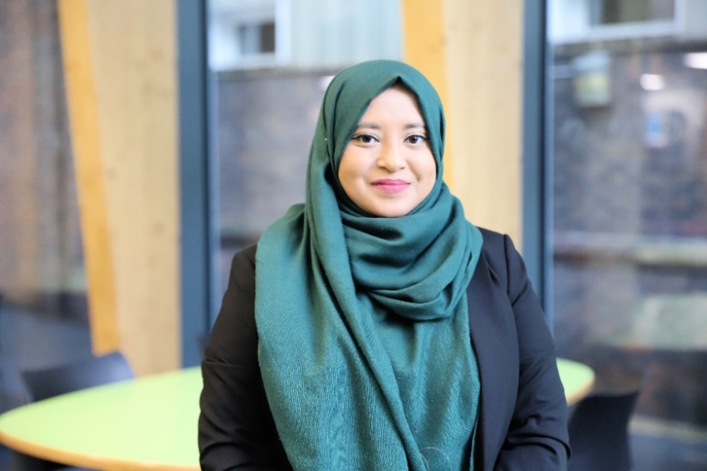 A woman smiling at the camera