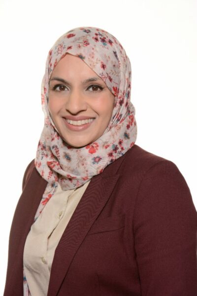 A woman smiling at the camera